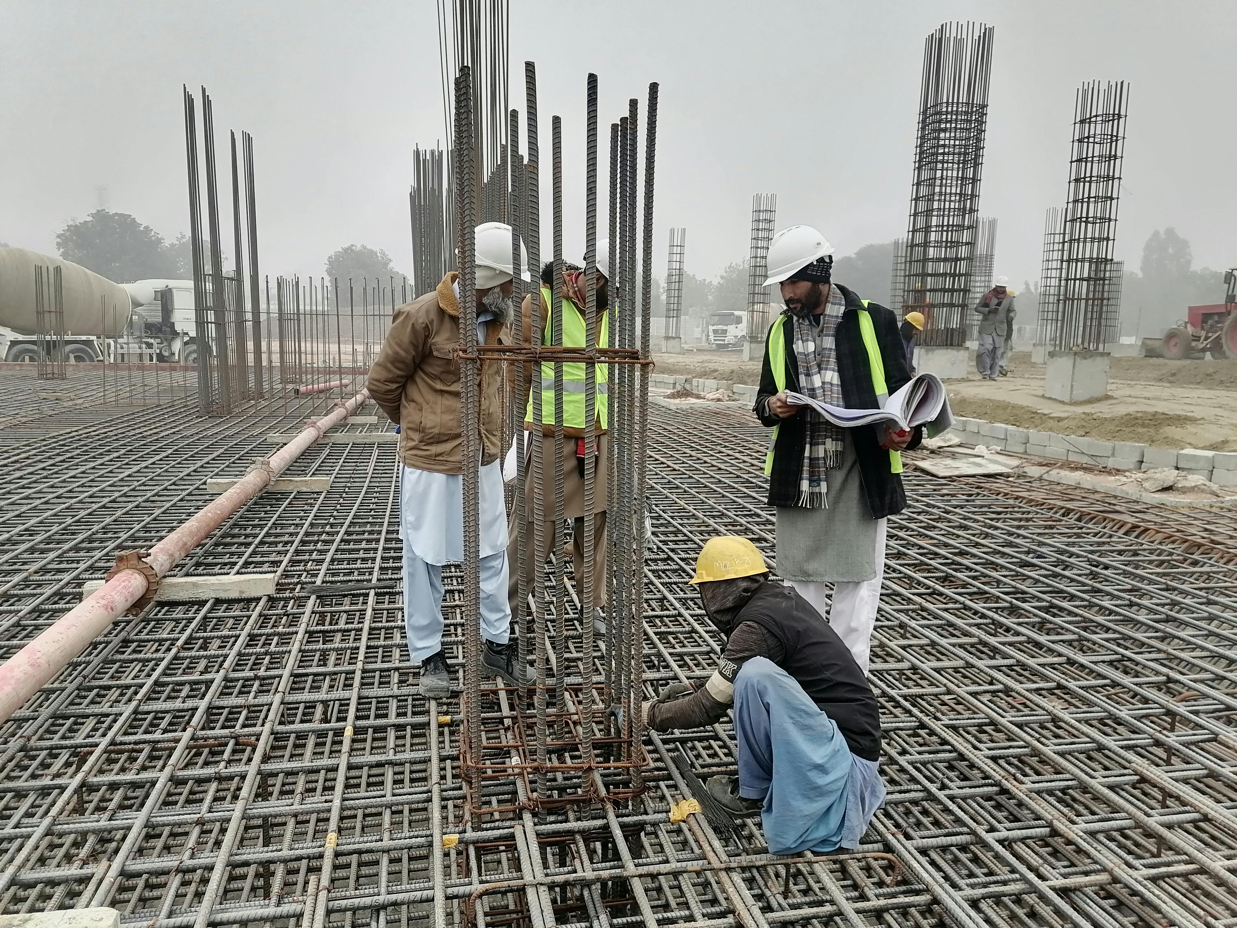 Professional engineering and construction team working on infrastructure project in Pakistan